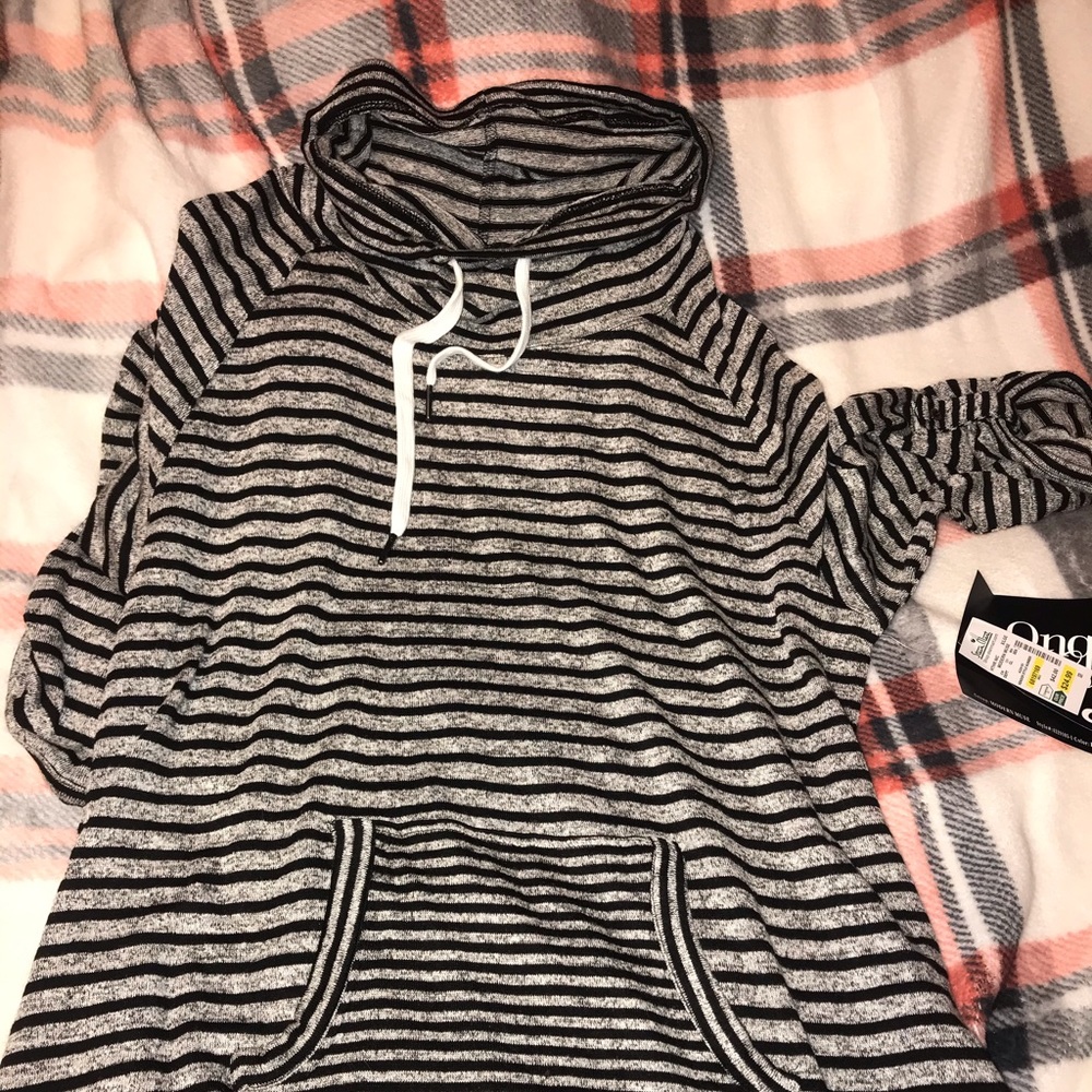 Sweater with pockets & swoop neck.